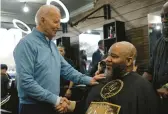  ?? KENT NISHIMURA/GETTY-AFP ?? President Joe Biden meets patrons Saturday at a men’s barbershop and spa in Columbia, South Carolina. The state’s Democratic primary is Feb. 3.