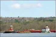  ?? TANIA BARRICKLO — DAILY FREEMAN FILE ?? A long barge passes the Esopus Meadows Lighthouse on the Hudson River between Ulster and Dutchess counties.