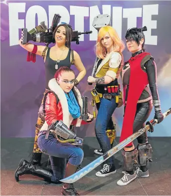  ??  ?? Fortnite cosplayers at Germany’s Gamescon.