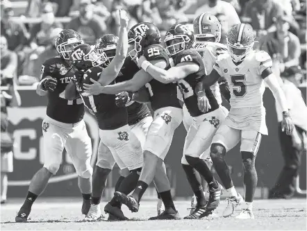  ?? Sam Craft, The Associated Press ?? Texas A& M place kicker Seth Small ( 47) celebrates with teammates after making the game- winning field goal against Florida as time expired Saturday in College Station, Texas.