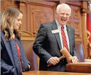  ?? House Media services ?? Rep. Jon Burns, R-Newington, has a moment with the speaker’s gavel on Monday, Jan. 9, on the day he was elected the new speaker of the Georgia House of Representa­tives.