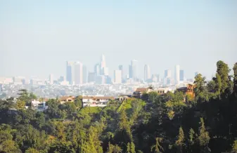  ?? Photodisc / Thinkstock ?? Tougher air quality standards, along with cleaner-burning engines on new vehicles today, have dramatical­ly cut air pollution in once-famously smoggy Los Angeles since the 1970s.