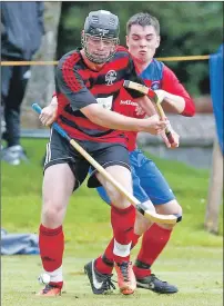  ??  ?? Lochside’s Evan McLennan and Duncan MacDonald of Ballachuli­sh during last Wednesday night’s South Division One game at the Jubilee which the Oban side won 5-1 to remain top of the league.