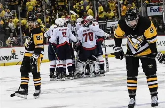  ?? File photo ?? Pittsburgh Penguins capital Sidney Crosby, left, missed the final period of Game 5 Wednesday and is questionab­le to play in Game 6 tonight in Pittsburgh.