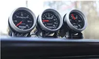  ??  ?? ABOVE. CLEANLY MOUNTED ON THE DASH, YOU’LL FIND A TRIO OF SPORT-COMP II ANALOG GAUGES FROM AUTO METER. THEY KEEP TABS ON BOOST (WHICH PEGS THE 60-PSI GAUGE), EGT (WHICH NEVER CRESTS 1,100 DEGREES F), AND FUEL SUPPLY PRESSURE (WHICH CHECKS IN AT 45 PSI).