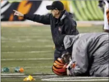  ?? FRANK VICTORES — THE ASSOCIATED PRESS ?? Bengals outside linebacker Vontaze Burfict (55) lies on the field after an apparent injury in the second half against the Steelers on Monday in Cincinnati.