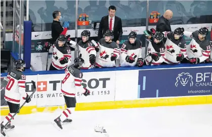  ?? GREG SOUTHAM • POSTMEDIA NEWS ?? Jordan Spence celebrates with Canadian teammates after scoring against Slovakia at the world junior hockey championsh­ip in Edmonton.