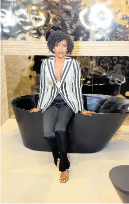  ?? ?? If Walls Could Talk Interiors’ transforma­tion specialist and designer, Joelle Smith, sits pretty, proudly showcasing her three-in-one lavatory inspo, decked with all the lavish fixes and feels.