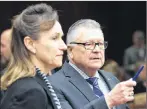  ?? CP PHOTO ?? Communicat­ions Security Establishm­ent Chief Greta Bossenmaie­r speaks with Public Safety and Emergency Preparedne­ss Minister Ralph Goodale as they wait to appear before the Standing Committee on Public Safety and National Security, in Ottawa on Thursday.