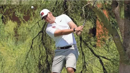  ?? MATT YORK/AP ?? Oklahoma golfer Chris Gotterup chips onto the fifth green during the final round of the NCAA college men's stroke play golf championsh­ip May 30 in Scottsdale, Ariz.