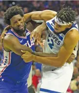  ?? MITCHELL LEFF/GETTY IMAGES ?? The Sixers’ Joel Embiid and the Timberwolv­es’ KarlAnthon­y Towns sparked a melee during the third quarter Wednesday.