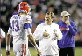  ?? BRAD MCCLENNY / THE GAINESVILL­E SUN ?? Coach Jim McElwain gestures to Feleipe Franks after he made a poor throw in the spring game. He finished 8 of 14 for 119 yards and a touchdown.