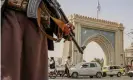  ?? Tuesday. Photograph: EPA ?? A Taliban fighter stands guard at a checkpoint in Kandahar, Afghanista­n, on