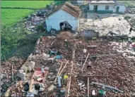  ?? FANG DONGXU / FOR CHINA DAILY ?? Villagers on Thursday clean up the rubble of a house that was destroyed during a tornado that hit Yancheng, Jiangsu province, on Wednesday.