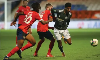  ?? Photograph: Matthew Peters/Manchester United/Getty Images ?? Manchester United’s Marcus Rashford in action at Luton in the Carabao Cup third round, one of several recent meetings between Premier League and EFL clubs.