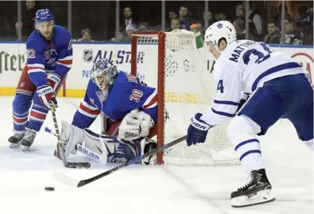  ?? BILL KOSTROUN/THE ASSOCIATED PRESS ?? Leaf Auston Matthews tries to beat Rangers goalie Henrik Lundqvist from a sharp angle in the first. He scored from a tighter spot in the second.