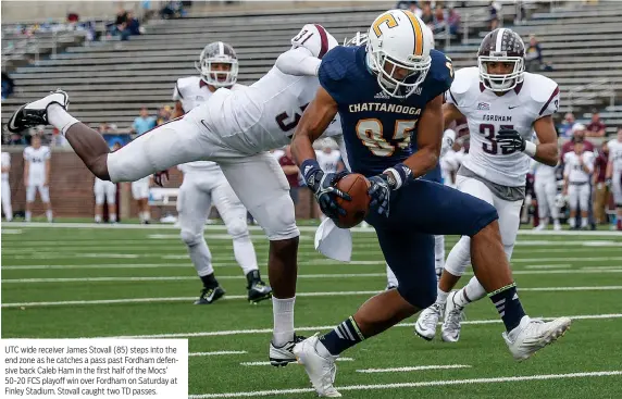  ?? STAFF PHOTOS BY DOUG STRICKLAND ?? UTC wide receiver James Stovall (85) steps into the end zone as he catches a pass past Fordham defensive back Caleb Ham in the first half of the Mocs’ 50-20 FCS playoff win over Fordham on Saturday at Finley Stadium. Stovall caught two TD passes.