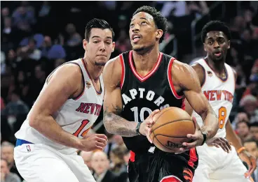  ?? SETH WENIG / THE ASSOCIATED PRESS ?? Toronto Raptors’ DeMar DeRozan drives to the basket during NBA action Sunday against the New York Knicks in New York. DeRozan had 35 points in Toronto’s 110-97 victory.