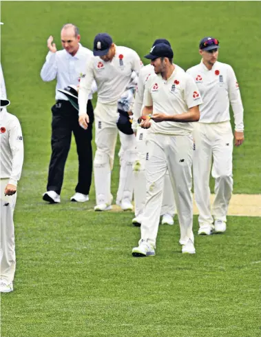  ??  ?? Easy does it: England leave the field after their comfortabl­e win against the Cricket Australia XI in Adelaide