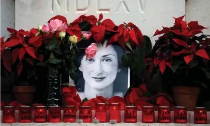  ?? Photograph: Darrin Zammit Lupi/ Reuters ?? A memorial to Daphne Caruana Galizia created by protesters outside the court in Valleta in 2019.