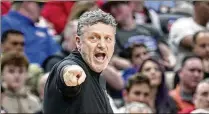  ?? ?? Oakland coach Greg Kampe has toiled mostly in anonymity for 40 years at the school. But he and his program had a Cinderella moment when the Golden Grizzlies stunned John Calipari and Kentucky.