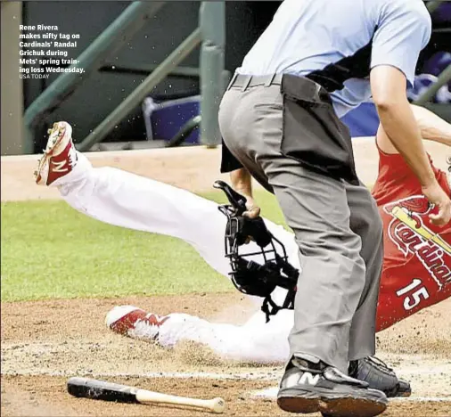  ?? USA TODAY ?? Rene Rivera makes nifty tag on Cardinals’ Randal Grichuk during Mets’ spring training loss Wednesday.