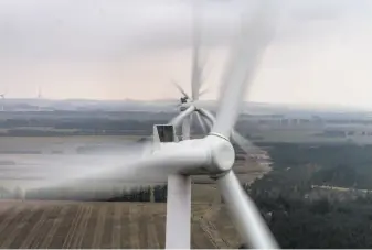  ?? Rasmus Degnbol / New York Times ?? Prototype wind turbines whirl at a testing site in Osterild, on Denmark’s Jutland peninsula.