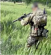  ?? NINE ?? A screenshot from video obtained by ABC Four Corners shows an Australian soldier allegedly about to murder a subdued Afghan man in a field in Oruzgan province in 2012.