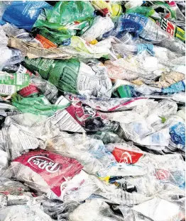  ?? AP ?? In this November 15, 2016 file photo, crushed plastic bottles sit in a bale following sorting at the Mid-America Recycling plant in Lincoln, Nebraska.