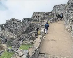 ?? CHRIS RIEMENSCHN­EIDER PHOTOS TNS ?? Early morning is a good time to beat the crowds at Machu Picchu. One of the world’s most-photograph­ed heritage sites, the Incan citadel looks even more awesome in person.