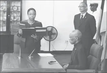  ??  ?? Justice Roxane George is sworn in as acting Chief Justice