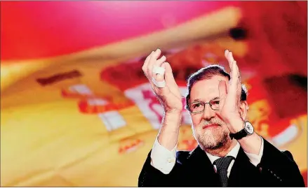  ?? CRISTINA QUICLER/AFP ?? Spanish Prime Minister Mariano Rajoy applauds during the national convention of the ruling People’s Party in Sevilla on Sunday.