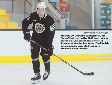  ?? STAFF PHOTO BY MATT WEST ?? MOVING ON UP: Urho Vaakanaine­n, the Bruins’ first pick in the 2017 draft, skates during a developmen­t camp workout Tuesday at Warrior Ice Arena. The Finnish defenseman is expected to play in Providence next season.