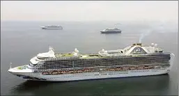  ?? The Associated Press ?? In this photo provided by the Philippine Coast Guard, cruise ship MV Ruby Princess stays anchored in Manila Bay anchorage area on Thursday in Manila, Philippine­s.