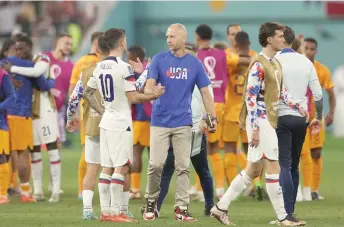  ?? — AFP photo ?? Christian Pulisic and USA’s coach Gregg Berhalter react at the end of the Qatar 2022 World Cup round of 16 football match between the Netherland­s and USA at Khalifa Internatio­nal Stadium in Doha.