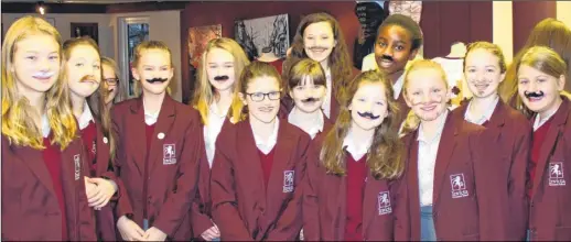  ??  ?? Pupils and staff at Invicta Grammar School in Maidstone took part in the Movember Challenge. Male members of staff grew their own moustaches, but the girls generally sported much more luxuriant growths, albeit fake. There efforts raised more than £285...