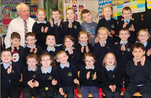  ??  ?? First class pupils with Pat Hamilton who has retired from his teaching post in St. Peter’s National School, Dromiskin after 43 years of service at the School.