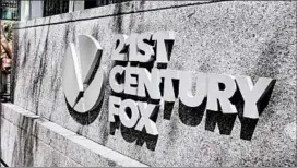  ?? RICHARD DREW/AP ?? Comcast says its cash bid for Fox entertainm­ent is 19% higher than Disney’s stock offer.