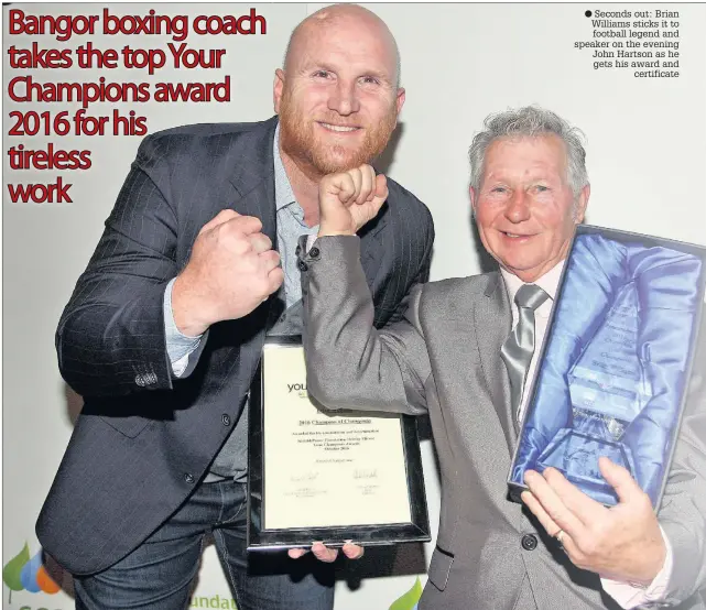  ??  ?? Seconds out: Brian Williams sticks it to football legend and speaker on the evening John Hartson as he gets his award and certificat­e