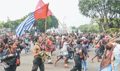  ?? — AFP photo ?? Papuans take part in a rally in front of the presidenti­al palace and army headquarte­rs in Jakarta.