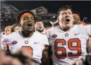  ?? SEAN RAYFORD — THE ASSOCIATED PRESS ?? Clemson quarterbac­k Kelly Bryant (2) and teammate Maverick Morris (69) celebrate after a game against South Carolina on Saturday in Columbia, S.C.