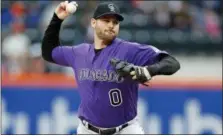  ?? ADAM HUNGER — THE ASSOCIATED PRESS ?? Colorado Rockies relief pitcher Adam Ottavino delivers a pitch during the ninth inning of a baseball game against the New York Mets on Sunday in New York. The Rockies won 3-2.