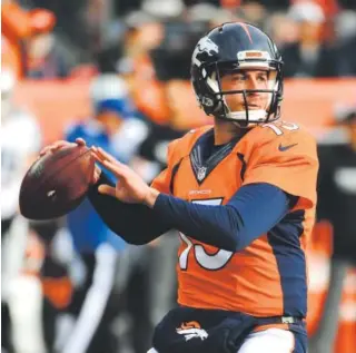  ??  ?? Broncos quarterbac­k Trevor Siemian sets up to pass against the Oakland Raiders at Sports Authority Field at Mile High on Jan. 1. Steve Nehf, Denver Post file