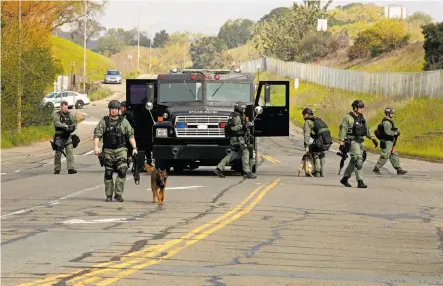  ?? Photos by Michael Macor / The Chronicle ?? Novato officers search for nine people after reports of at least three North Bay home invasions. Four suspects were arrested.