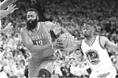  ??  ?? James Harden #13 of the Houston Rockets drives on Ian Clark #21 of the Golden State Warriors in Game Five of the Western Conference Quarterfin­als during the 2016 NBA Playoffs at ORACLE Arena on April 27, 2016 in Oakland, California. - AFP photo
