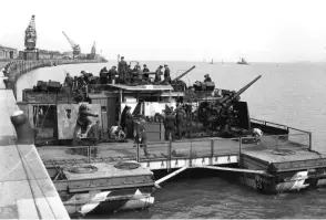  ??  ?? ■ Left: A fully kitted out heavy flak Siebel Ferry of Flak Abteilung 253, Zeebrugge, 1940. With four x 88mm and two 20mm cannon there is little wonder that the German army called these craft ‘Destroyer replacemen­ts.’ With little or no naval support, these guns would be doing double duty defending the invasion force.