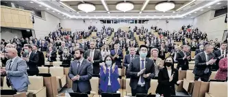  ?? SPUTNIK via AFP ?? THE State Duma, Russia’s lower house of parliament MPs, applauded after they voted to ratify President Vladimir Putin’s agreements with east Ukraine’s two separatist republics during a plenary session in Moscow on Tuesday. The agreements enable Russia to send troops, set up military bases and jointly defend the territorie­s of the Donetsk People’s Republic and Lugansk People’s Republic. |