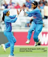  ?? — AFP ?? Jemimah Rodrigues (left) and Deepti Sharma.