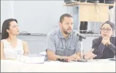  ?? (Photo by Keno George) ?? Lawyers attached to the Movement Against Parking Meters addressing persons at the group’s Town Hall meeting yesterday. From left: Attorney’s Pauline Chase, Ronald Burch-Smith and Nadia Sagar.