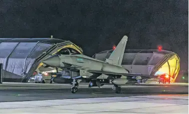  ?? U.K. MINISTRY OF DEFENSE VIA THE ASSOCIATED PRESS ?? A British Royal Air Force Typhoon aircraft at an airbase in Cyprus on Thursday after attacking Houthi targets in Yemen.